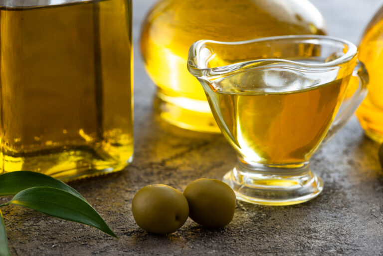 close-up-cup-olive-oil-green-olives